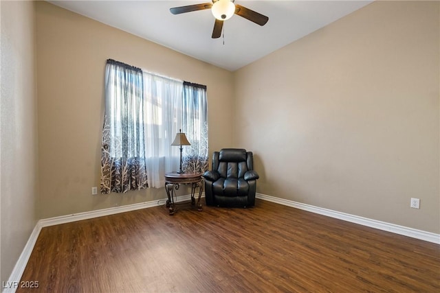 sitting room featuring wood finished floors, a ceiling fan, and baseboards