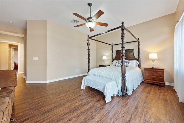 bedroom featuring a ceiling fan, baseboards, visible vents, and wood finished floors