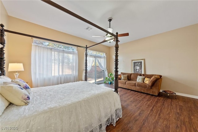 bedroom featuring wood finished floors, visible vents, a ceiling fan, baseboards, and access to outside