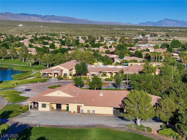 birds eye view of property featuring a mountain view