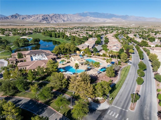 bird's eye view with a residential view and a water and mountain view