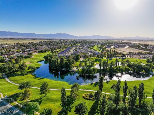 drone / aerial view with a water and mountain view