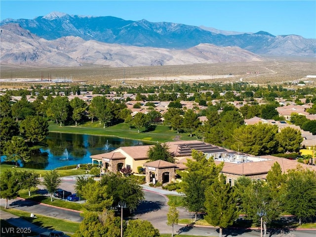 birds eye view of property featuring a water and mountain view