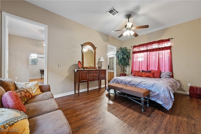 bedroom featuring wood finished floors, visible vents, baseboards, and multiple windows