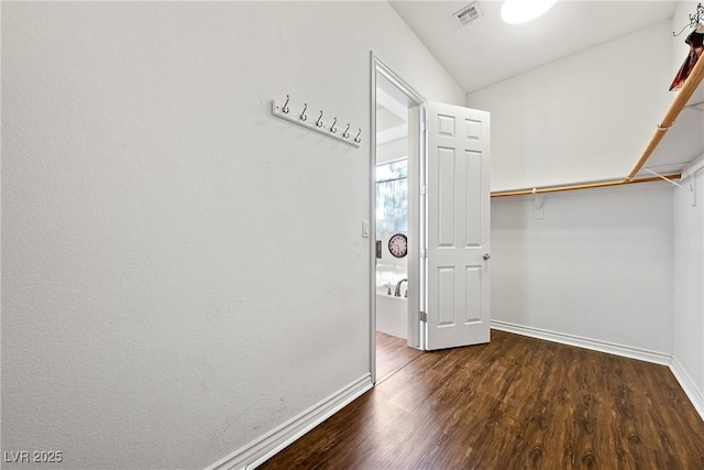 walk in closet featuring wood finished floors and visible vents