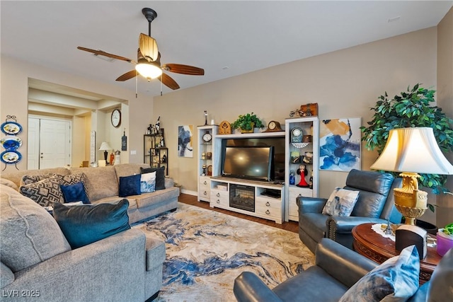 living room with ceiling fan and wood finished floors