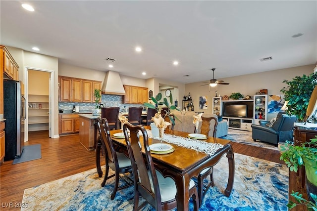 dining space featuring recessed lighting, visible vents, and wood finished floors