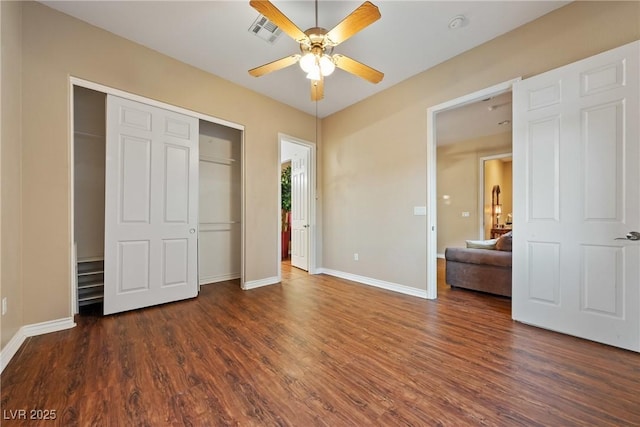 unfurnished bedroom featuring a ceiling fan, visible vents, baseboards, a closet, and dark wood finished floors