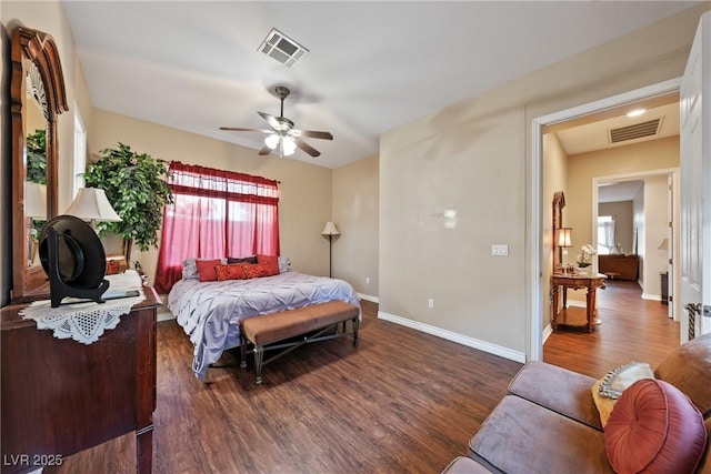 bedroom featuring baseboards, visible vents, ceiling fan, and wood finished floors