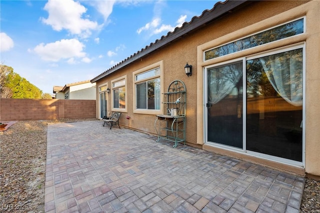 view of patio / terrace featuring fence