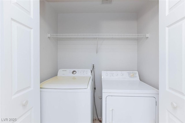 washroom featuring laundry area and washer and dryer