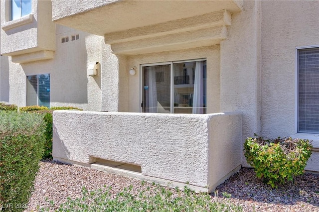 view of side of property featuring stucco siding