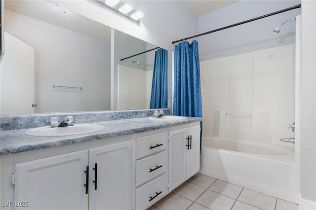 full bathroom featuring double vanity, tile patterned flooring, shower / bath combo with shower curtain, and a sink