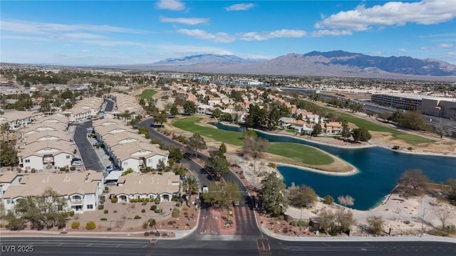 aerial view with a water and mountain view, a residential view, and golf course view