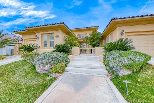 view of front of home featuring a garage and stucco siding