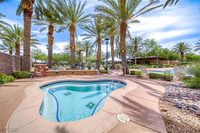 community pool with a patio