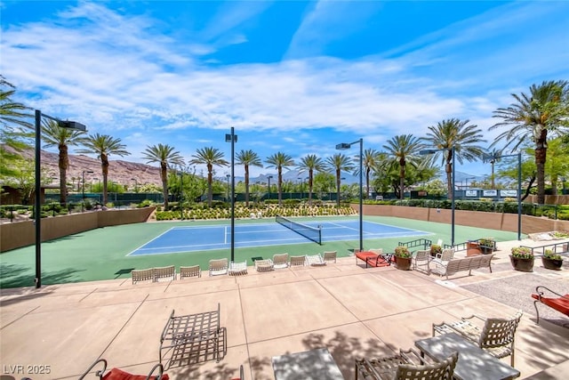 view of sport court with fence