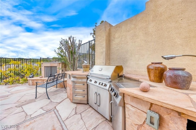 view of patio / terrace with grilling area, area for grilling, and fence