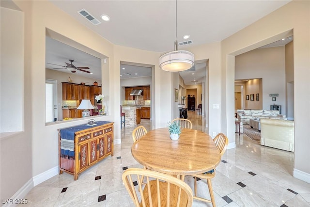 dining space with recessed lighting, visible vents, and baseboards