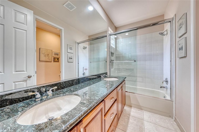 full bathroom featuring double vanity, tile patterned flooring, a sink, and visible vents