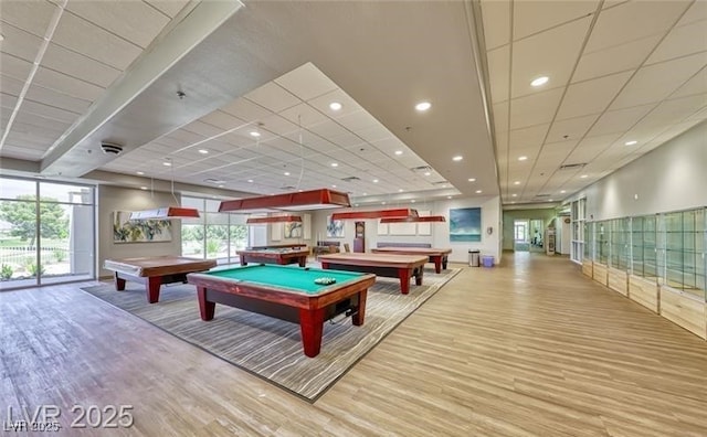 game room featuring pool table, wood finished floors, a paneled ceiling, and recessed lighting