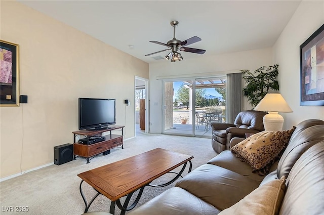 living room featuring a ceiling fan, light colored carpet, and baseboards