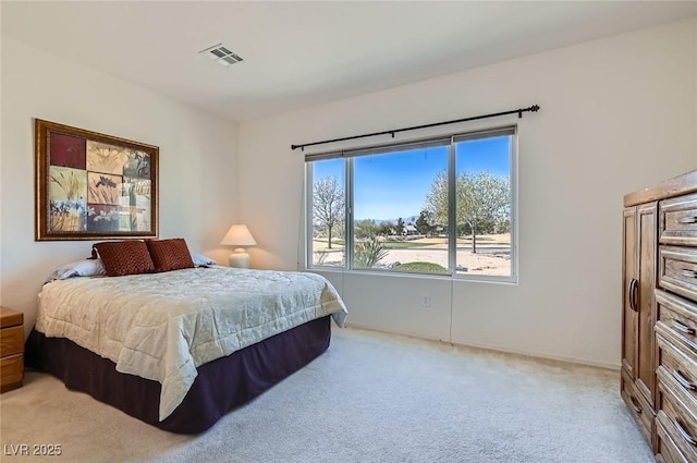 bedroom with light carpet and visible vents