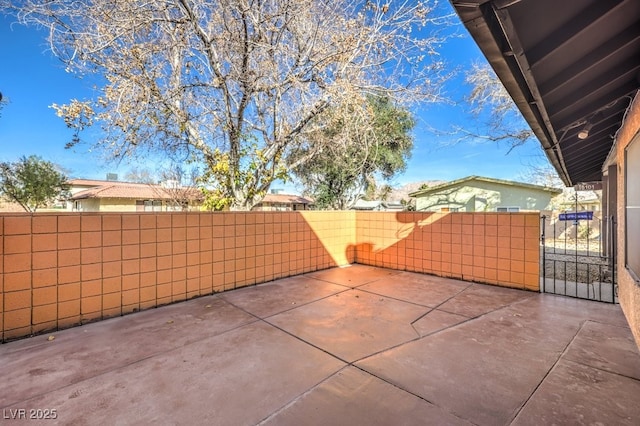 view of patio / terrace featuring a gate and fence