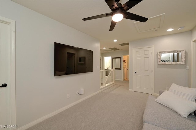 living room featuring recessed lighting, light colored carpet, visible vents, attic access, and baseboards