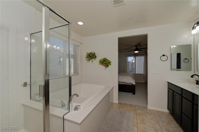 full bath with ensuite bath, a shower stall, visible vents, and tile patterned floors