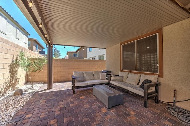 view of patio featuring a fenced backyard and an outdoor hangout area