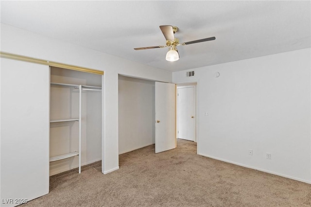 5265 Caspian Springs Dr Unit 201, Las Vegas, NV 89120 - unfurnished bedroom with carpet floors, ceiling fan, baseboards, and multiple closets