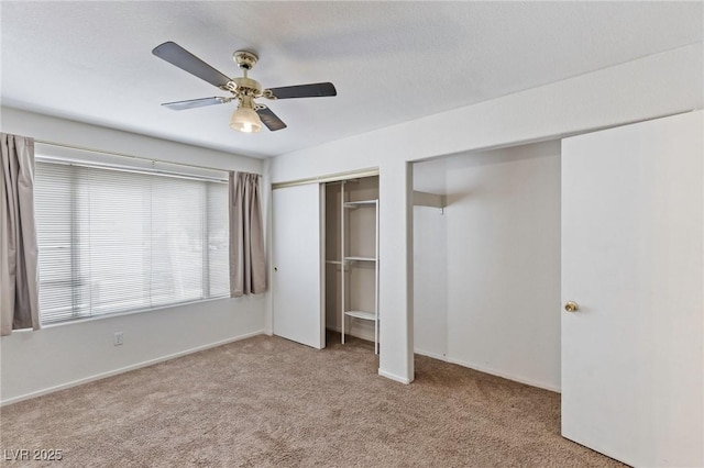 5265 Caspian Springs Dr Unit 201, Las Vegas, NV 89120 - unfurnished bedroom featuring carpet, multiple closets, ceiling fan, and baseboards