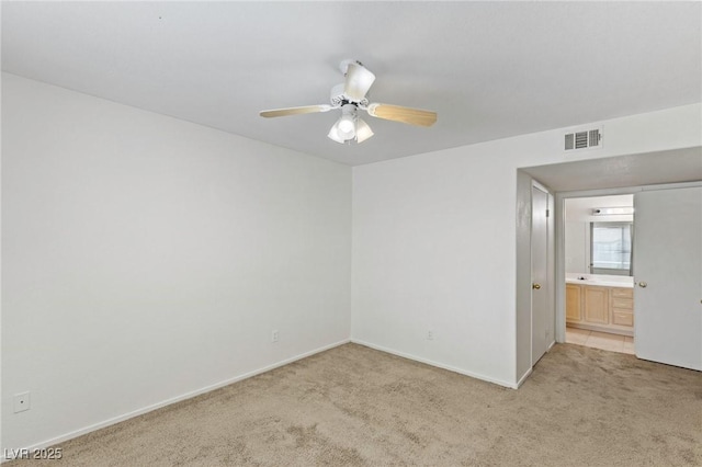 5265 Caspian Springs Dr Unit 201, Las Vegas, NV 89120 - empty room featuring light colored carpet, a ceiling fan, and baseboards