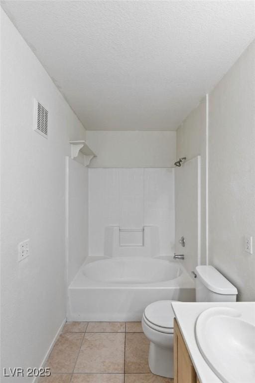 5265 Caspian Springs Dr Unit 201, Las Vegas, NV 89120 - full bathroom featuring vanity, toilet, tile patterned flooring, washtub / shower combination, and a textured ceiling