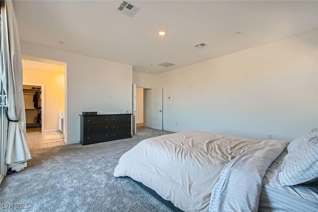 tiled bedroom featuring carpet flooring, visible vents, and recessed lighting