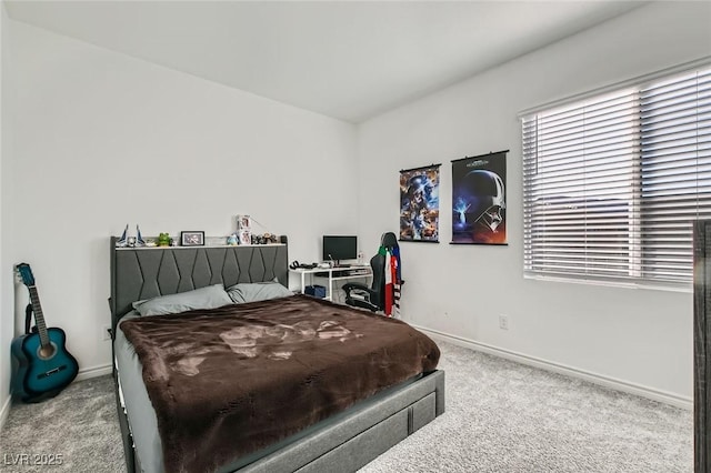 carpeted bedroom with baseboards