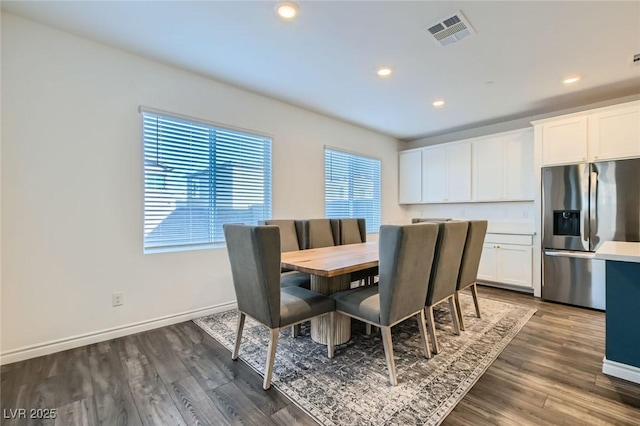 dining room featuring baseboards, visible vents, dark wood finished floors, and recessed lighting