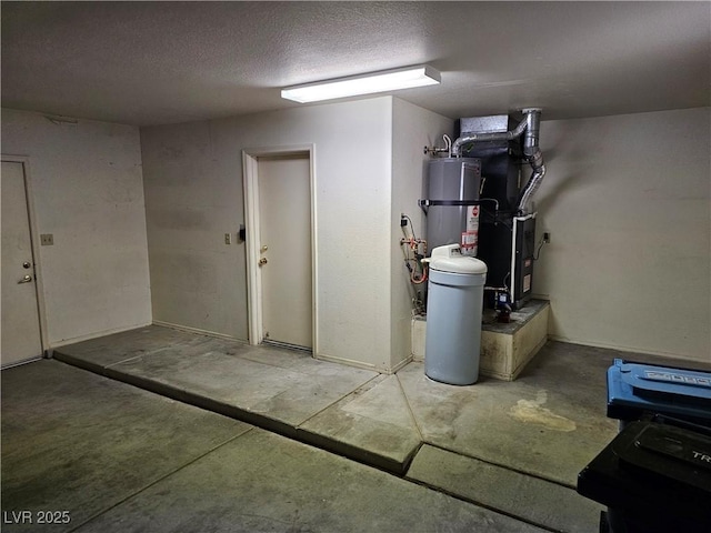 finished below grade area with heating unit, strapped water heater, and a textured ceiling