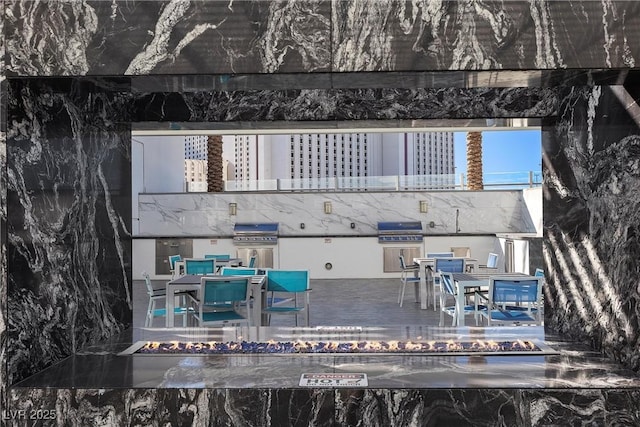 2700 Las Vegas Blvd Unit 1202, Las Vegas, NV 89109 - rear view of property with outdoor dining space and a deck