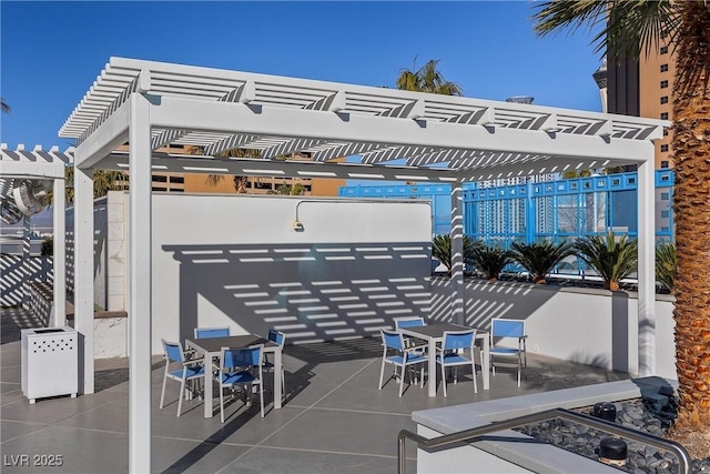 view of patio featuring outdoor dining area and a pergola