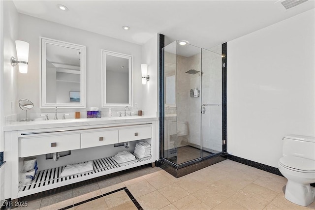 bathroom with a stall shower, visible vents, a sink, and toilet