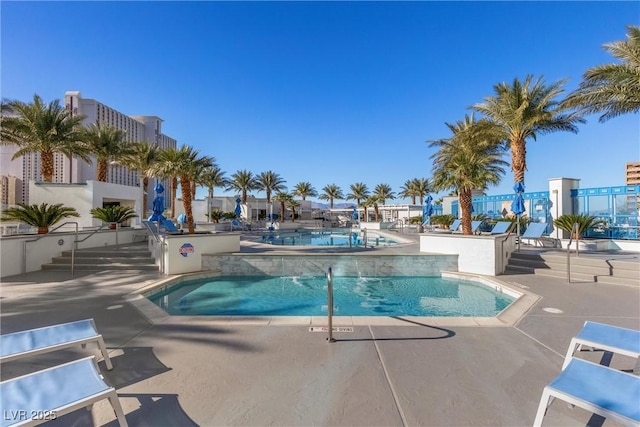 pool with a patio area