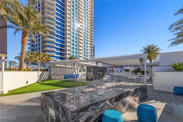 view of patio / terrace with fence and a pergola