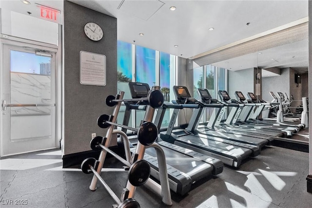 exercise room with expansive windows and plenty of natural light