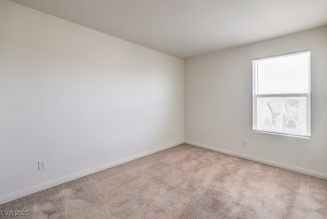 4542 Townwall St, Las Vegas, NV 89115 - empty room featuring baseboards and light colored carpet