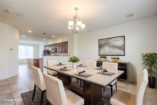 4542 Townwall St, Las Vegas, NV 89115 - dining space with recessed lighting, light tile patterned flooring, visible vents, and an inviting chandelier