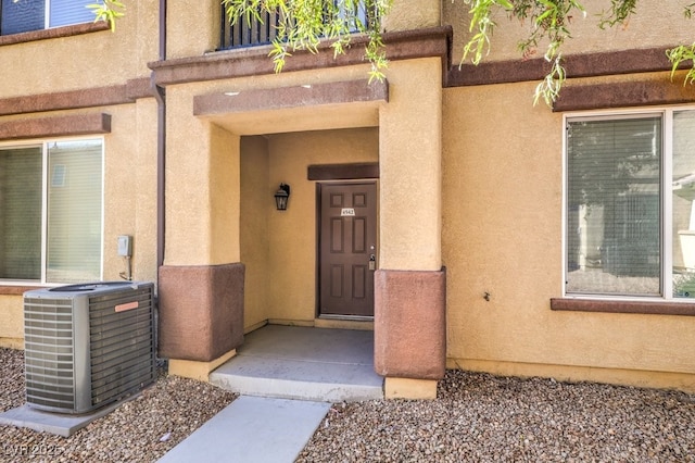 4542 Townwall St, Las Vegas, NV 89115 - property entrance with stucco siding and central air condition unit