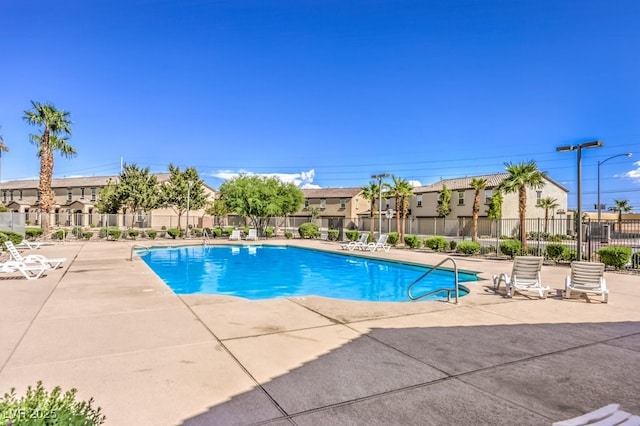 4542 Townwall St, Las Vegas, NV 89115 - pool with a patio area, a residential view, and fence