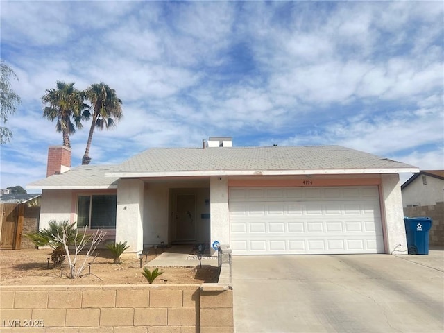 ranch-style home featuring an attached garage, fence, driveway, stucco siding, and a chimney